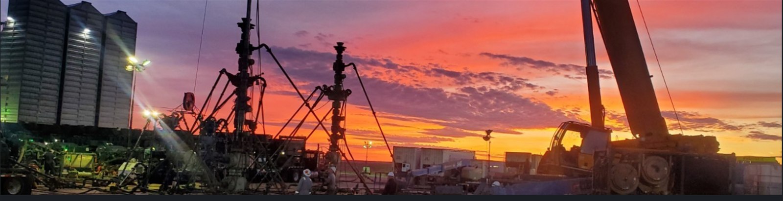 Completion wellsite frac spread at sunset